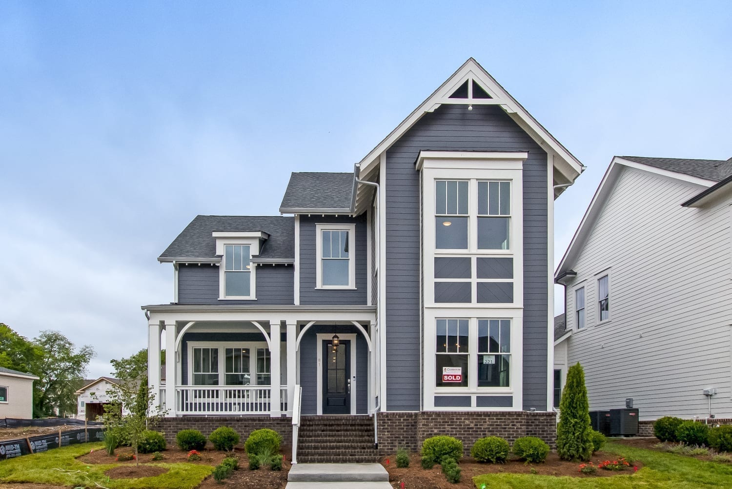 A navy blue two story home in stephens valley
