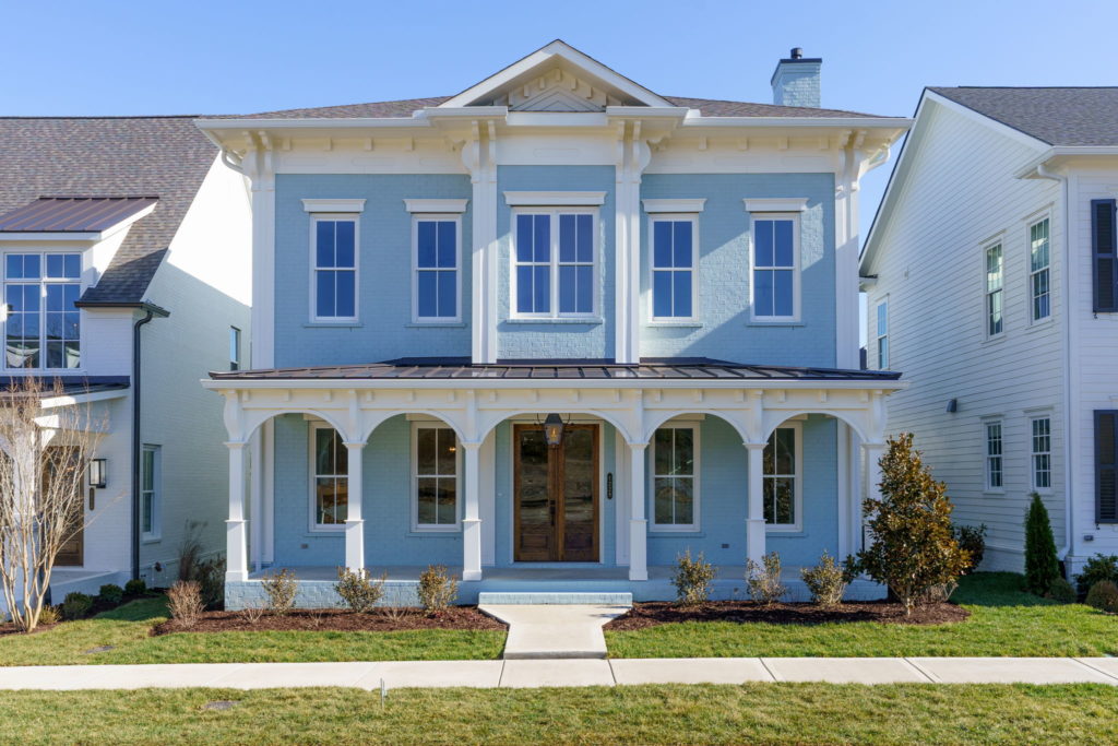 A two story light blue home in stephens valley