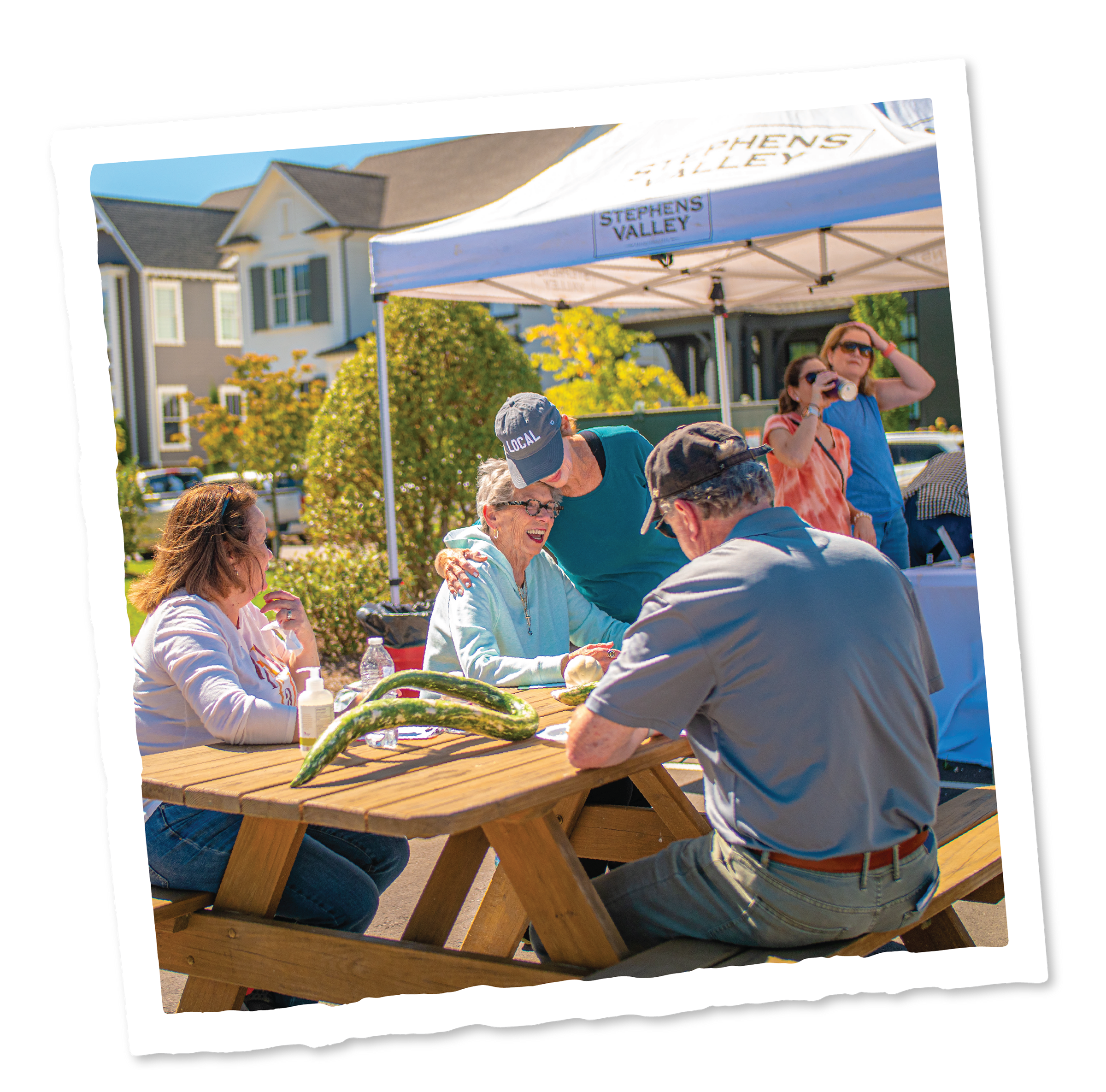 Images_Events-02 A group of people sitting at a wooden table