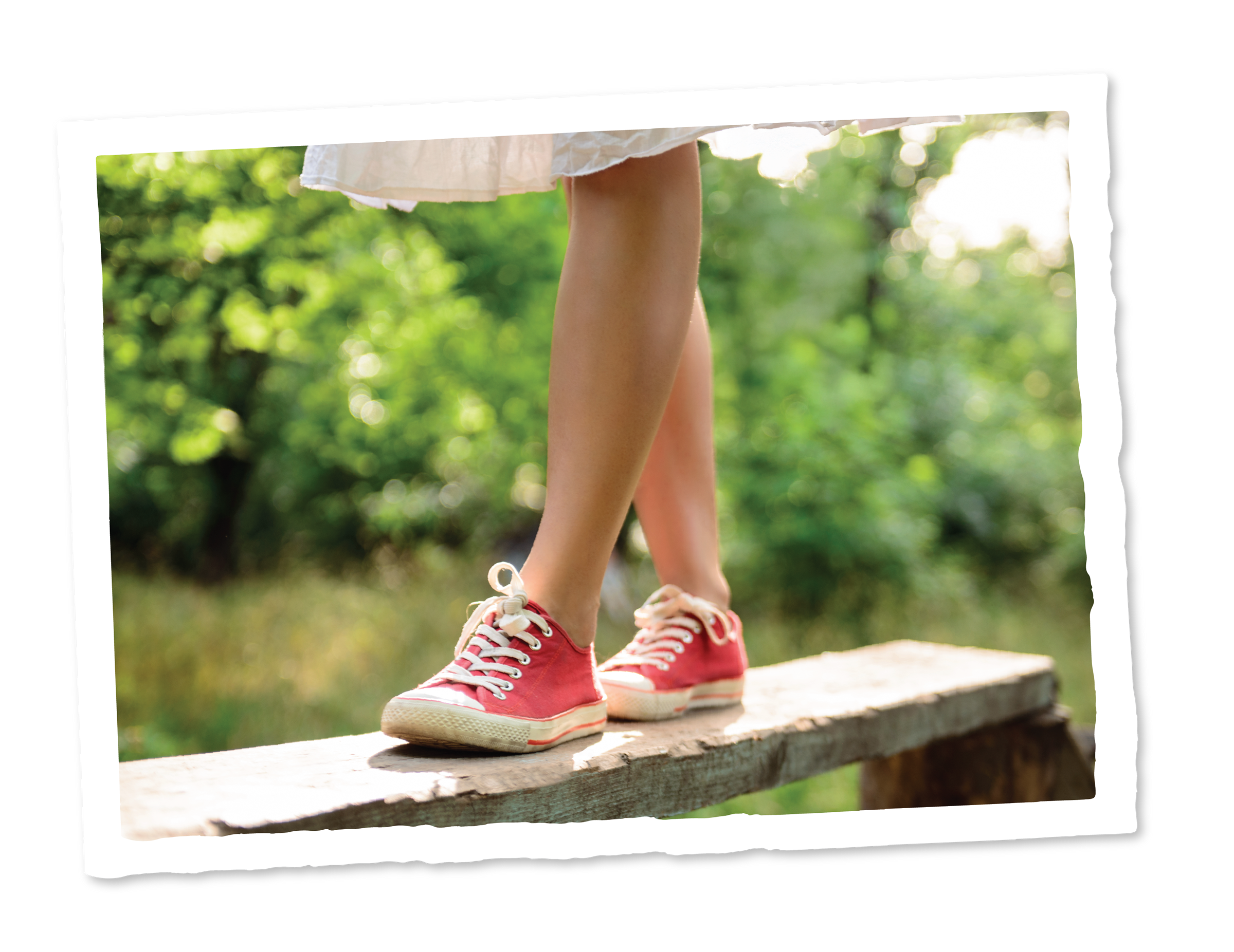 Images_LifestyleAmenities-03 A girl walking on a wooden ledge with trees in the background