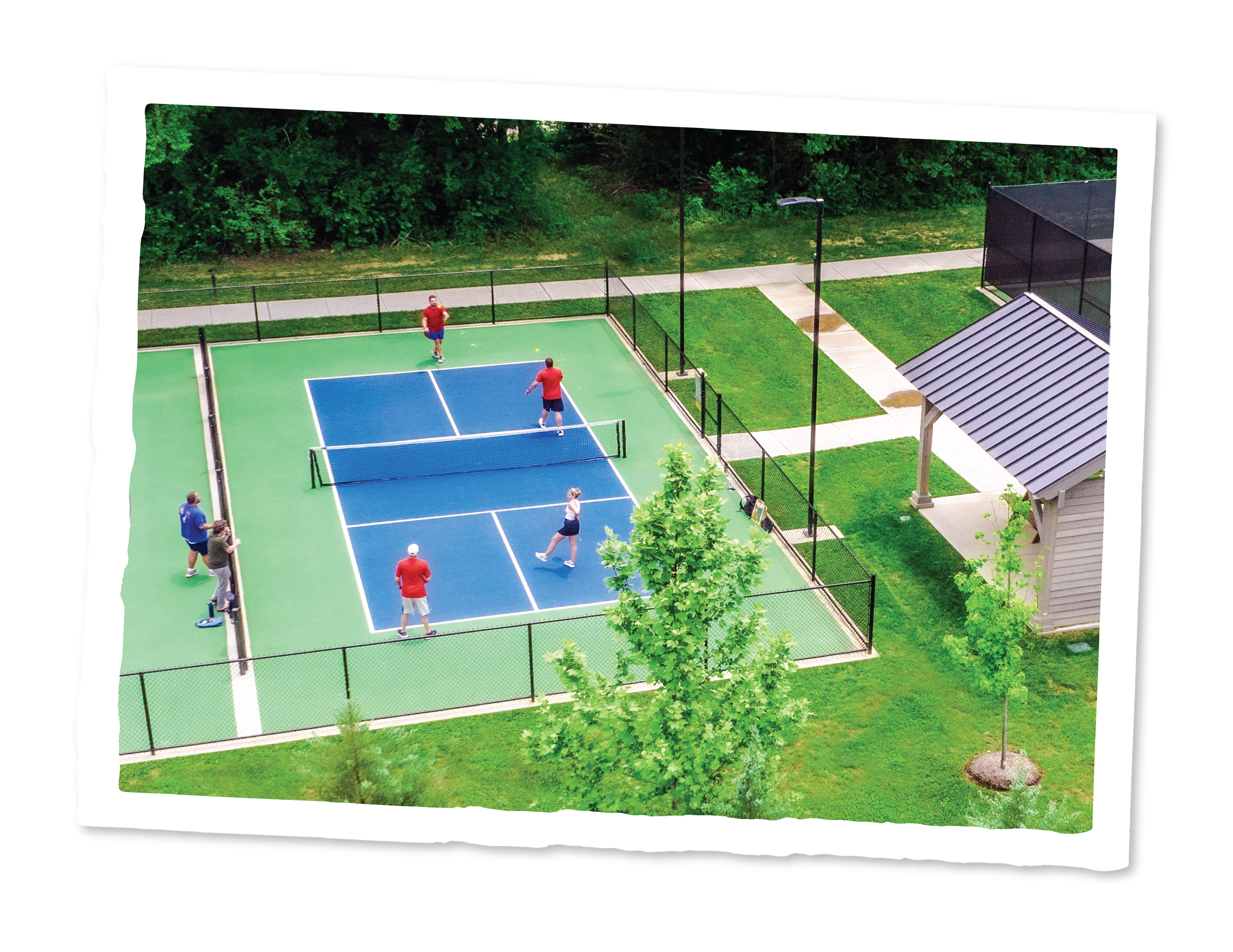 Images_LifestyleAmenities-06 A pickle ball court with people playing