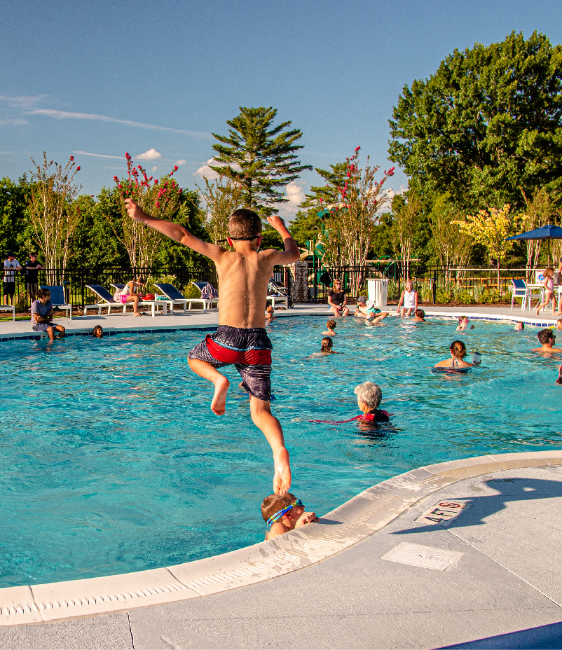 Images_LifestylePgs-02 A child jumping into the stephens valley community pool