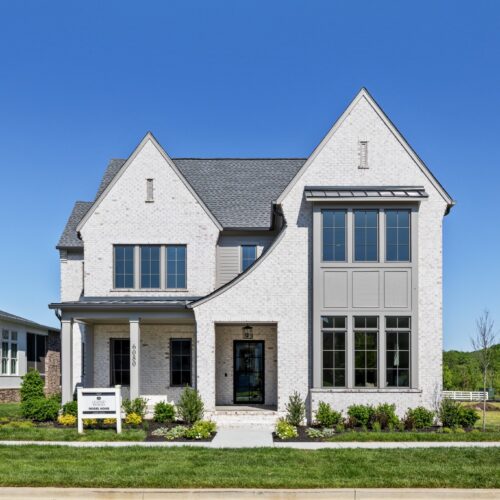A white brick home made by Legend homes