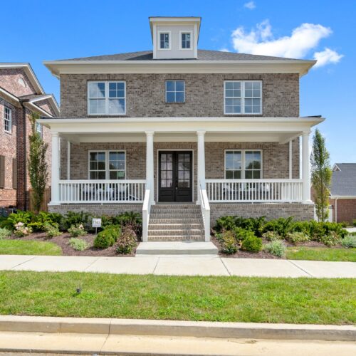 A two story brick home made by rochford realty