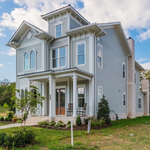 A gray two story home made by defatta custom homes