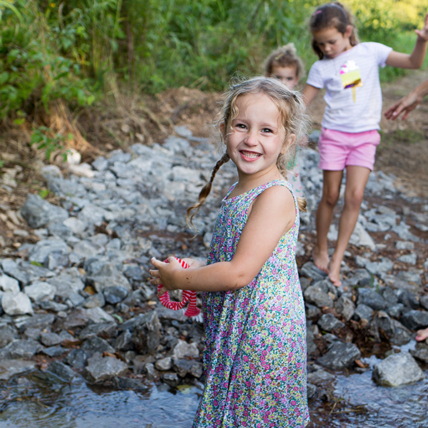 A group of girls playing in a creek in stephens valley