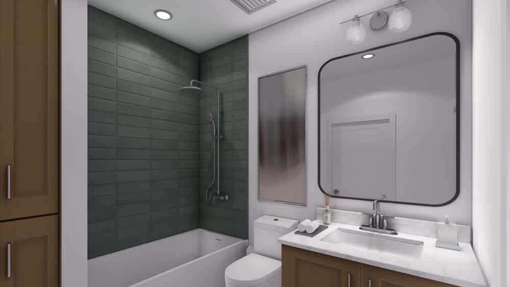 A white walled bathroom with green tile shower