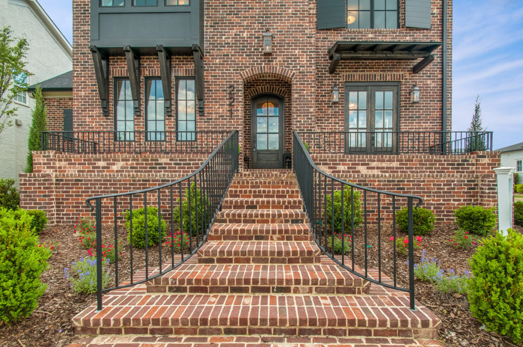 An outdoor brick stairway leading to a brick home in stephens valley