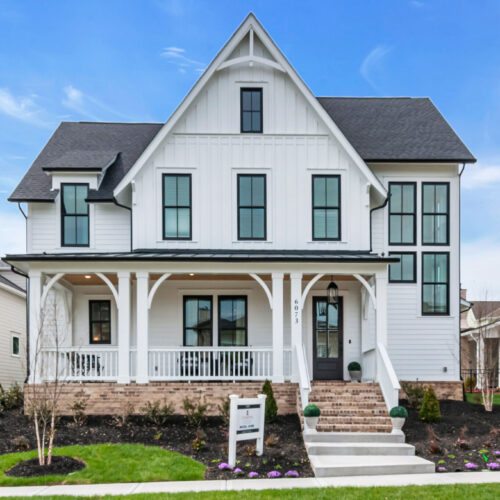 A white two story home made by celebration homes