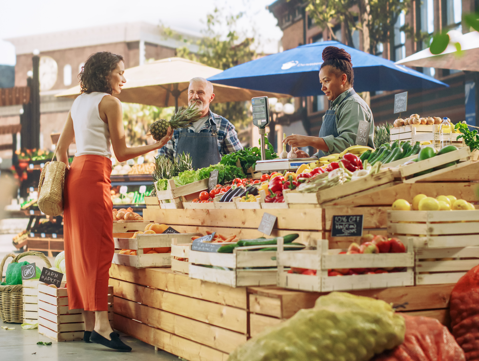 Three people at a farmers market