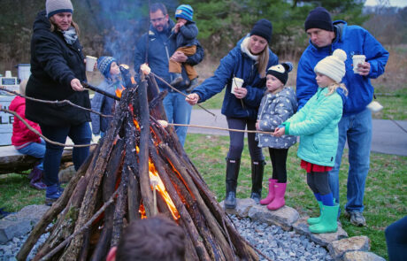 People gathering around a bonfire