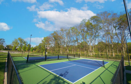 Tennis courts and a basketball hoop
